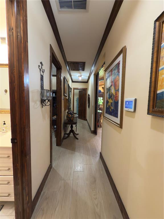 842 Hunting Club Avenue Clewiston, FL 33440 - Photo 17 of 34 a view of a hallway with a hallway