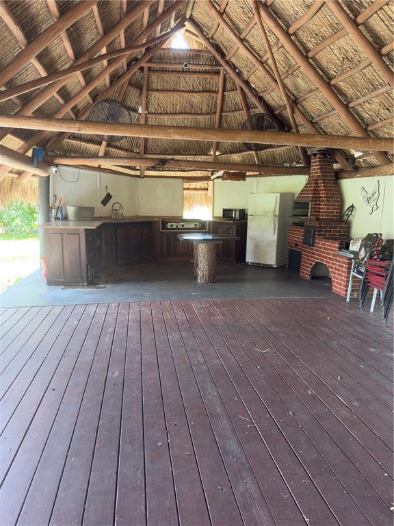 842 Hunting Club Avenue Clewiston, FL 33440 - Photo 27 of 34 a view of a garage with wooden floor