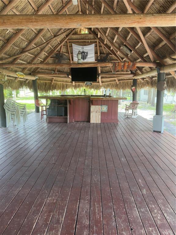 842 Hunting Club Avenue Clewiston, FL 33440 - Photo 29 of 34 a view of a room with wooden floor