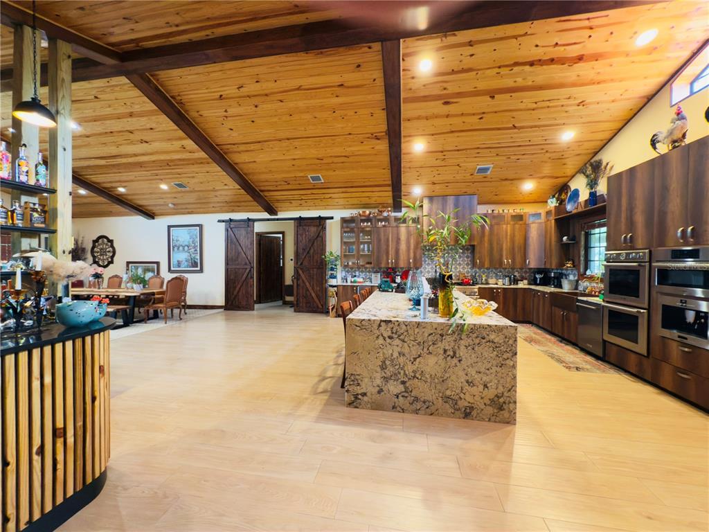 842 Hunting Club Avenue Clewiston, FL 33440 - Photo 7 of 34 a view of a patio with table and chairs