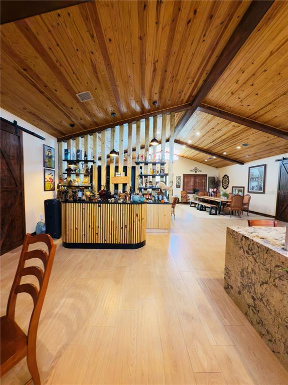 842 Hunting Club Avenue Clewiston, FL 33440 - Photo 8 of 34 a view of a swimming pool with seating space