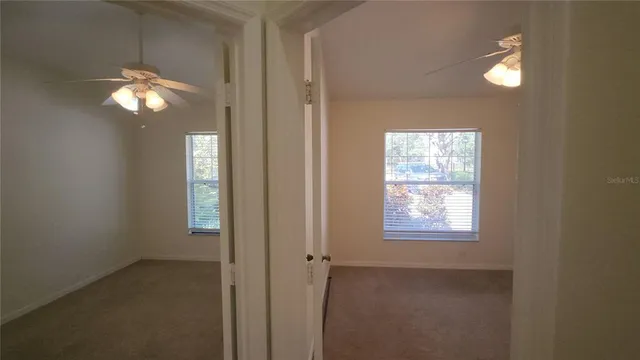 a view of a livingroom with window bathroom