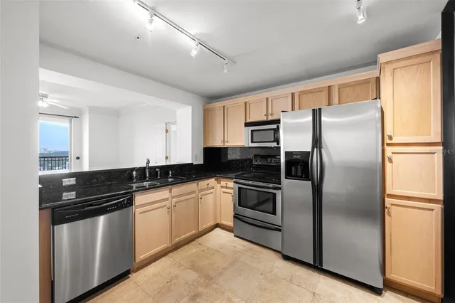 a bathroom with a glass shower door