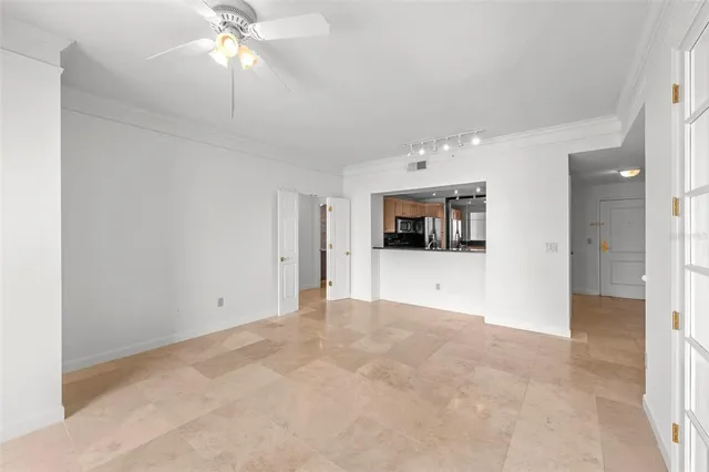 a view of an empty room with a window