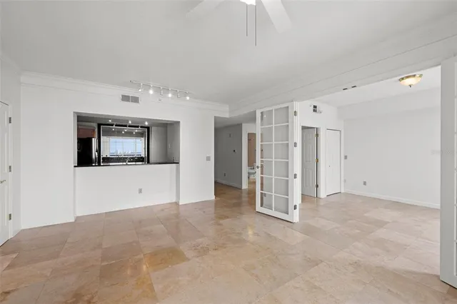 a bathroom with a granite countertop sink a mirror and a shower