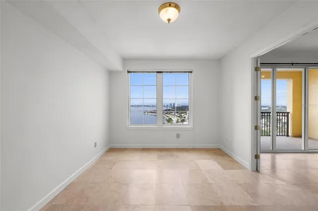a bathroom with a granite countertop sink a mirror and shower