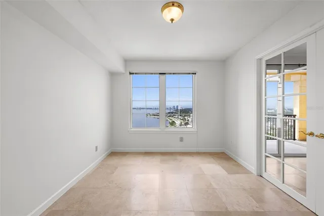 a bathroom with a glass shower door
