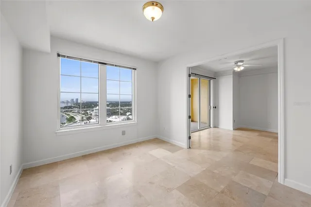a utility room with dryer washer and a view of bathroom