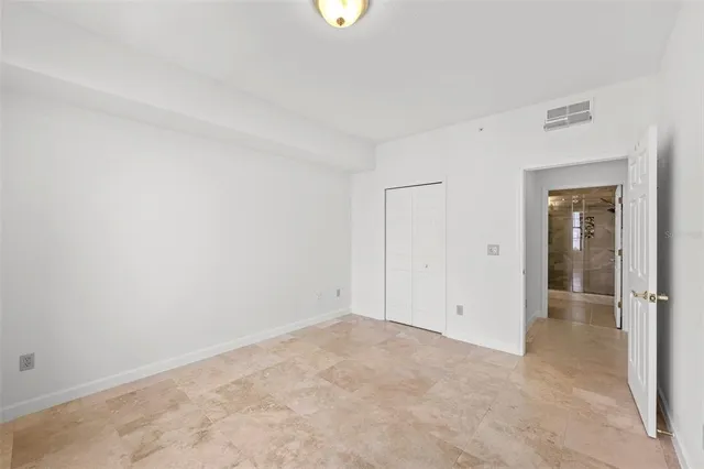 a lobby with furniture and a potted plant