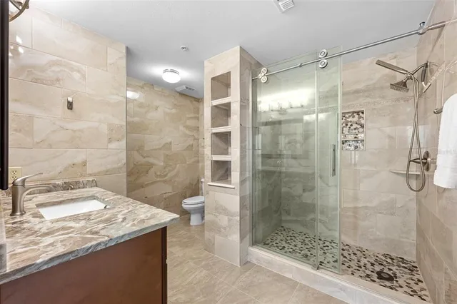 a view of living room with furniture and a potted plant