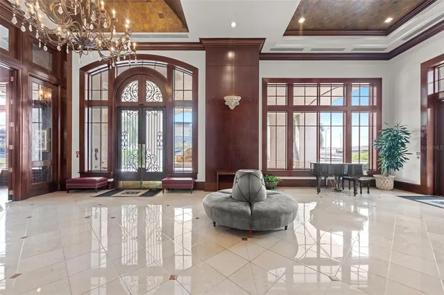 a view of a tall building next to a yard