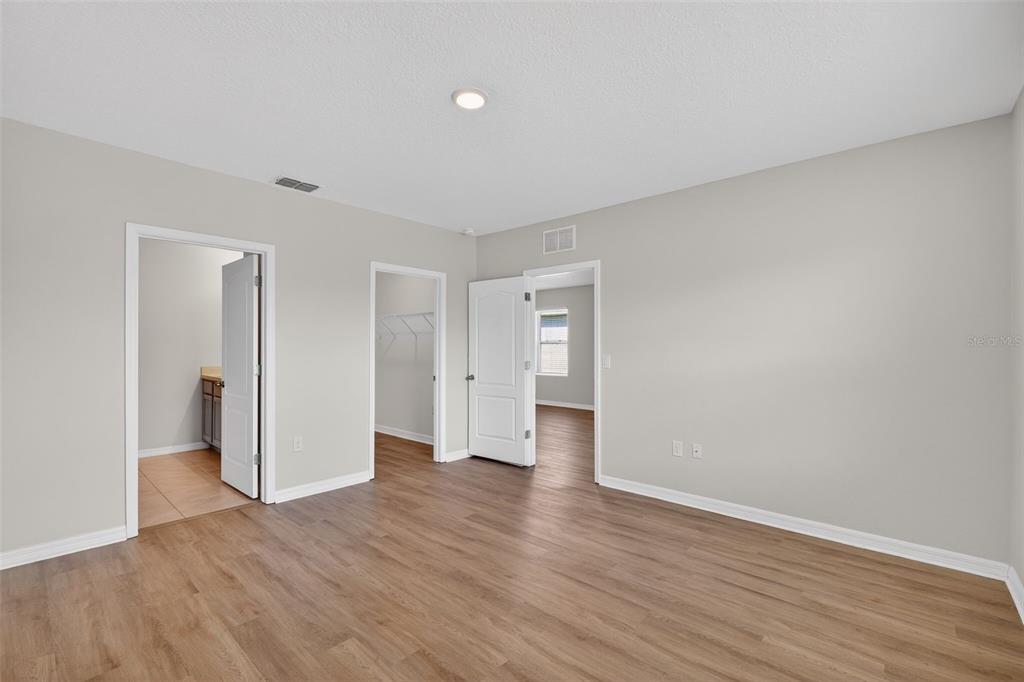 349 Honey Bell Road Winter Haven, FL 33880 - Photo 19 of 29 a view of empty room with wooden floor