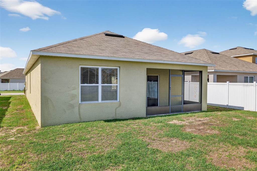 349 Honey Bell Road Winter Haven, FL 33880 - Photo 2 of 29 a house with yard in front of it