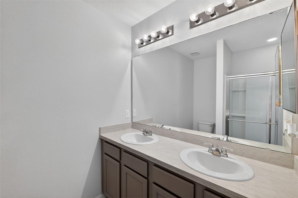 349 Honey Bell Road Winter Haven, FL 33880 - Photo 22 of 29 a bathroom with a sink and a mirror