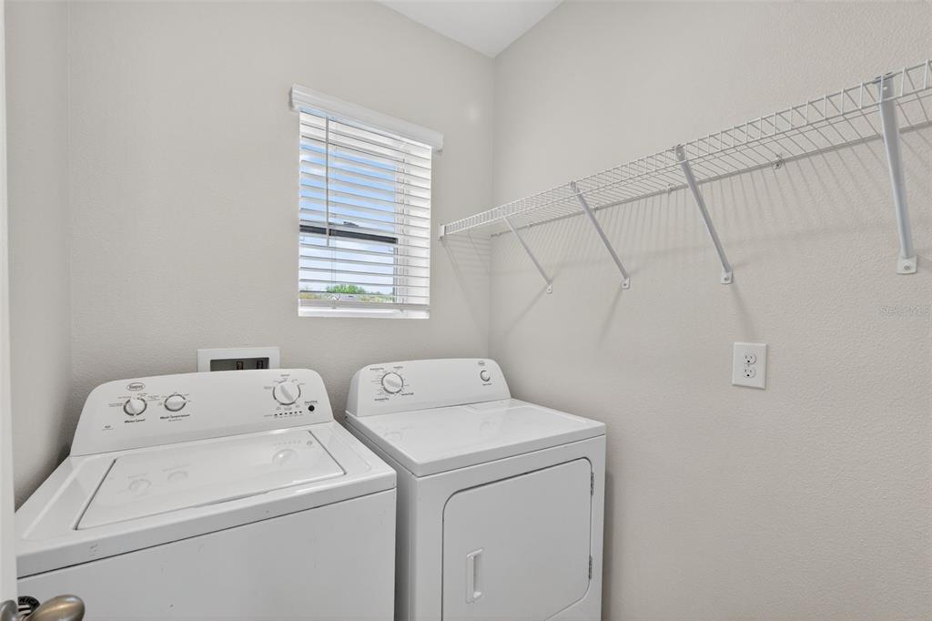 349 Honey Bell Road Winter Haven, FL 33880 - Photo 24 of 29 a utility room with dryer and washer