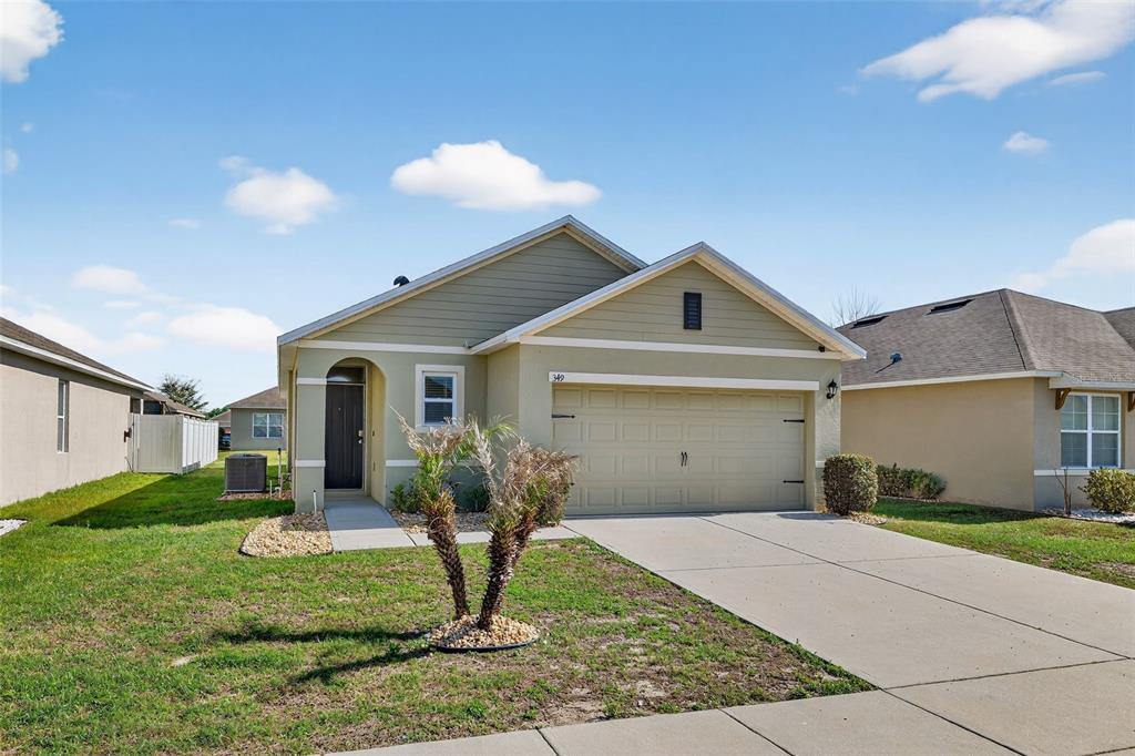 349 Honey Bell Road Winter Haven, FL 33880 - Photo 29 of 29 a front view of a house with garden