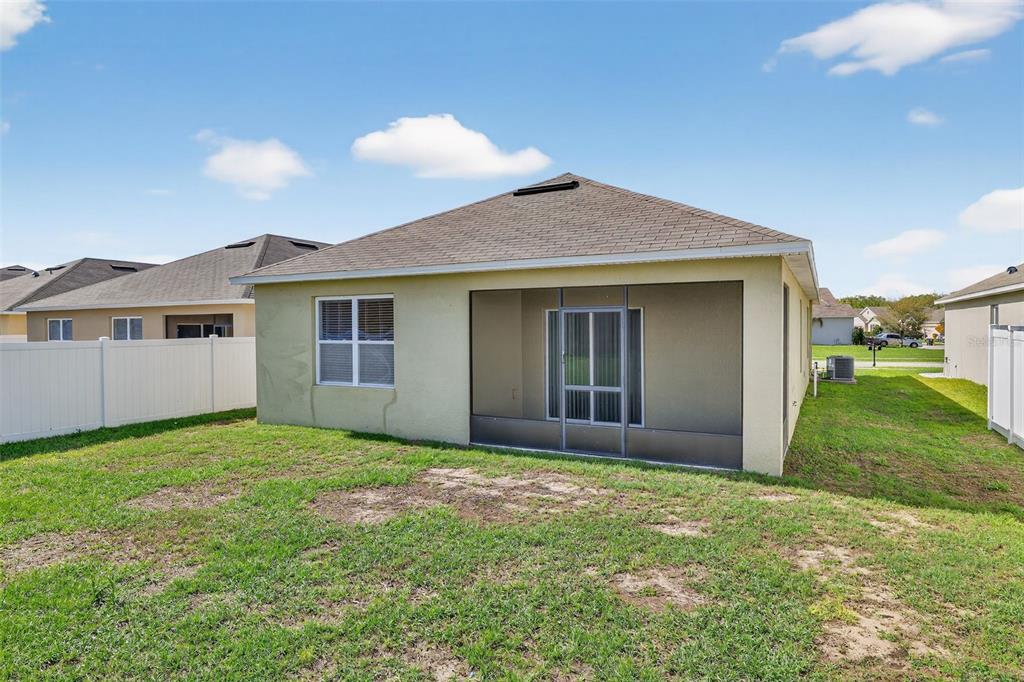 349 Honey Bell Road Winter Haven, FL 33880 - Photo 3 of 29 a view of a house with yard and porch