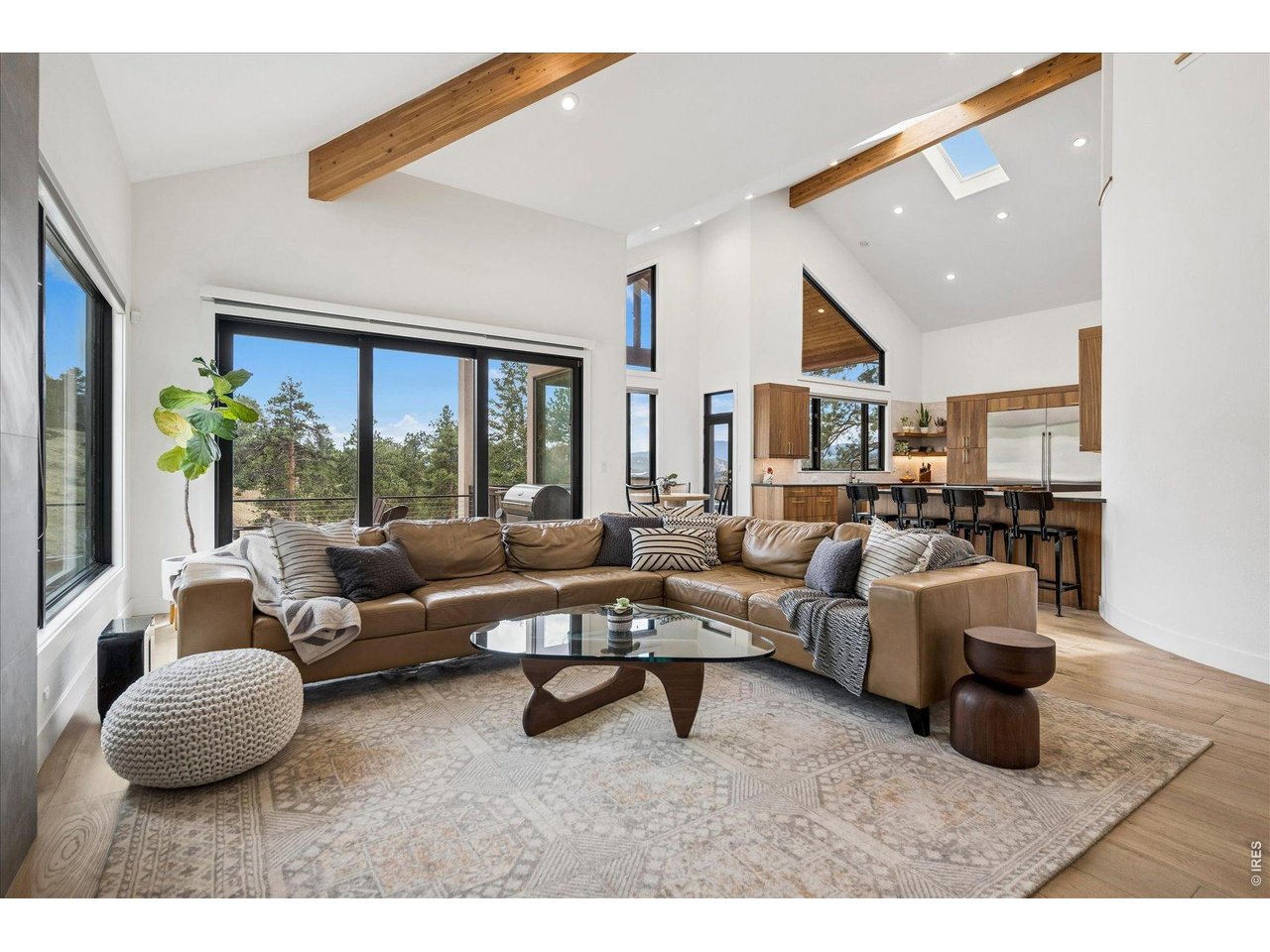 1424 Solitude Lane Evergreen, CO 80439 - Photo 11 of 46 a living room with furniture and a large window