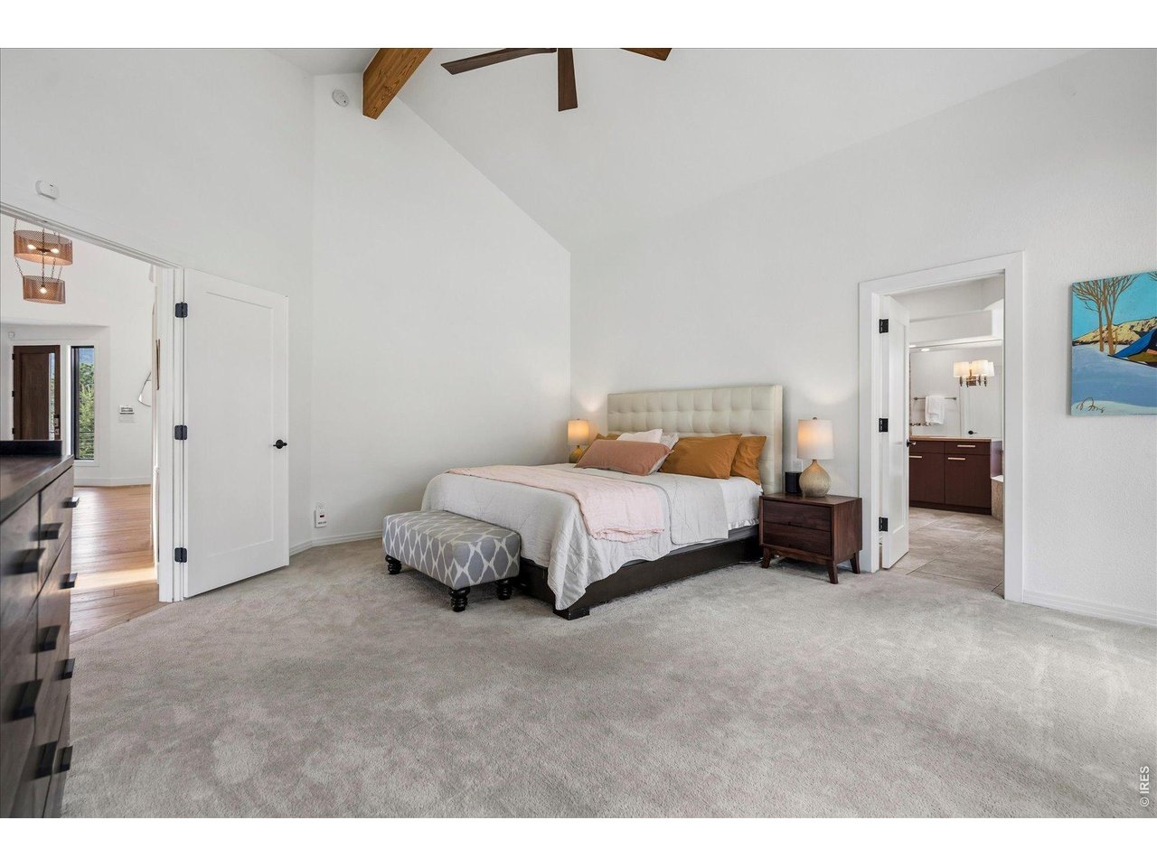 1424 Solitude Lane Evergreen, CO 80439 - Photo 18 of 46 a bedroom with a bed and a view of bathroom