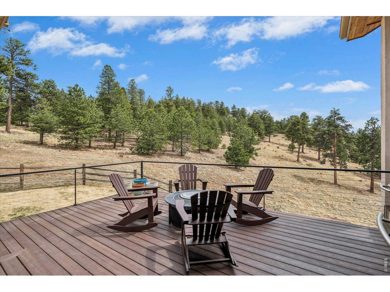 1424 Solitude Lane Evergreen, CO 80439 - Photo 2 of 46 a view of a terrace with seating area