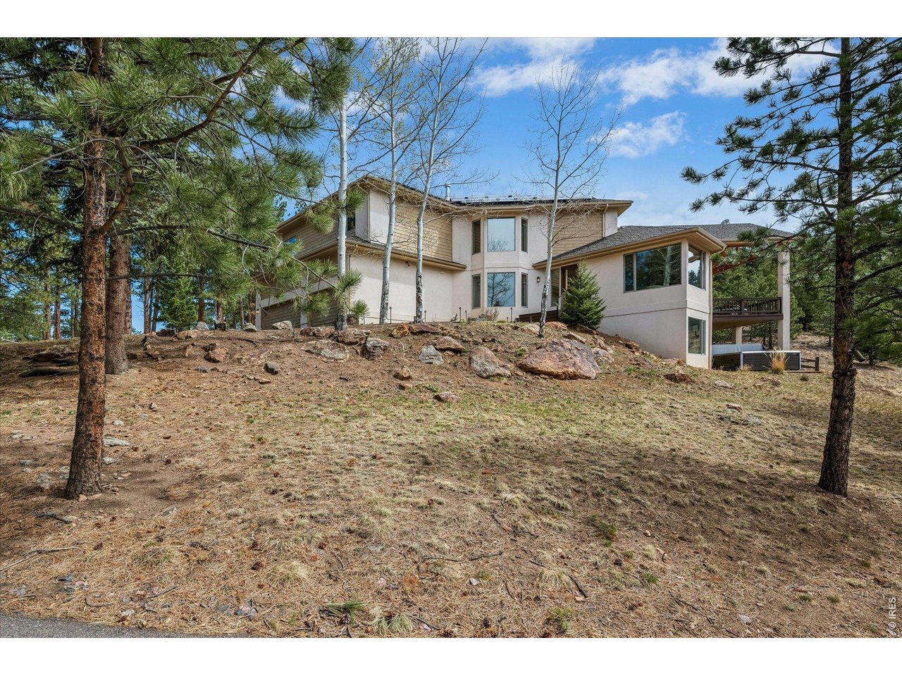1424 Solitude Lane Evergreen, CO 80439 - Photo 41 of 46 a view of a house with a snow