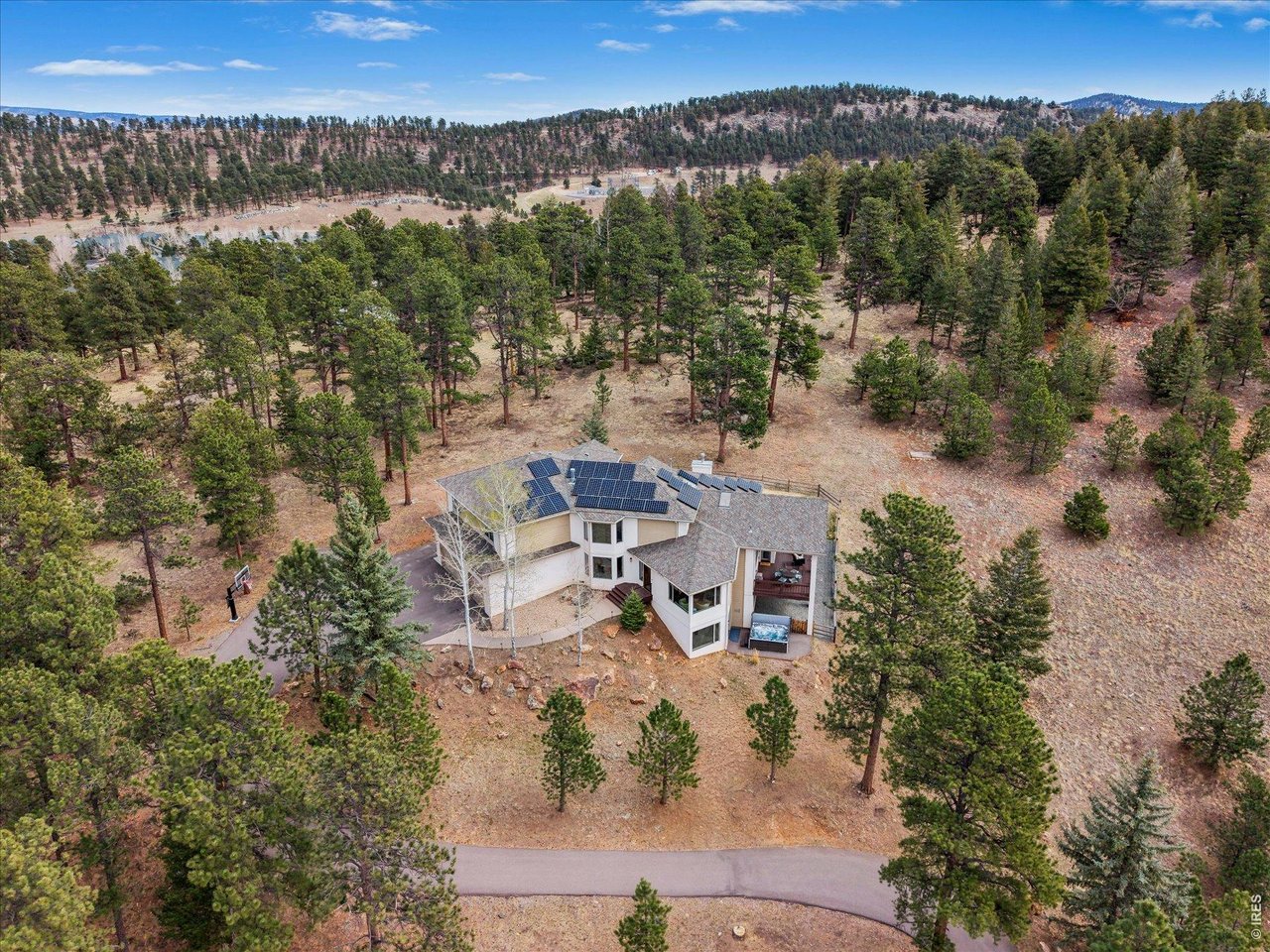 1424 Solitude Lane Evergreen, CO 80439 - Photo 42 of 46 an aerial view of a house with a yard