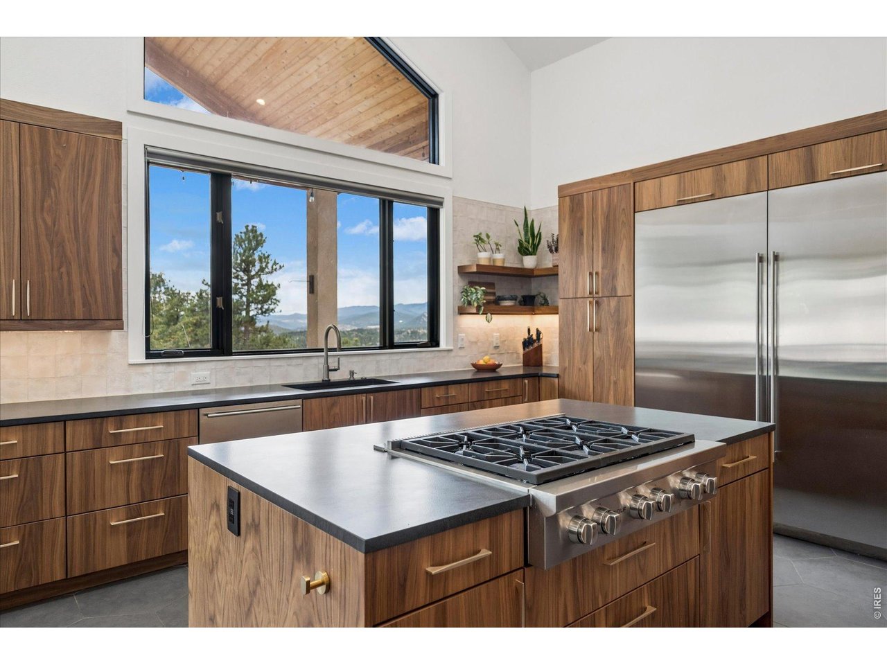 1424 Solitude Lane Evergreen, CO 80439 - Photo 5 of 46 a kitchen with a appliances a sink cabinets and a window