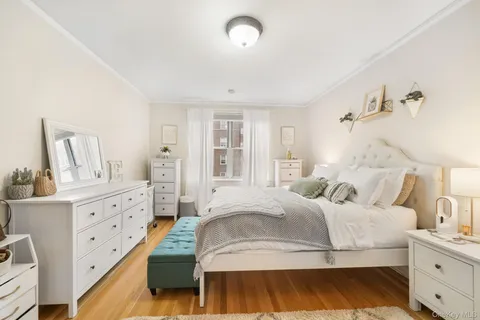 a bedroom with a bed and a cabinets