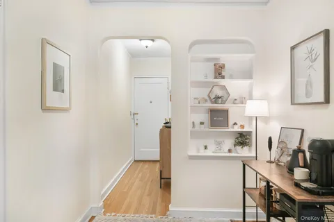 a room with a refrigerator and cabinets