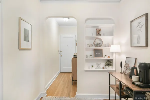 a room with a refrigerator and cabinets