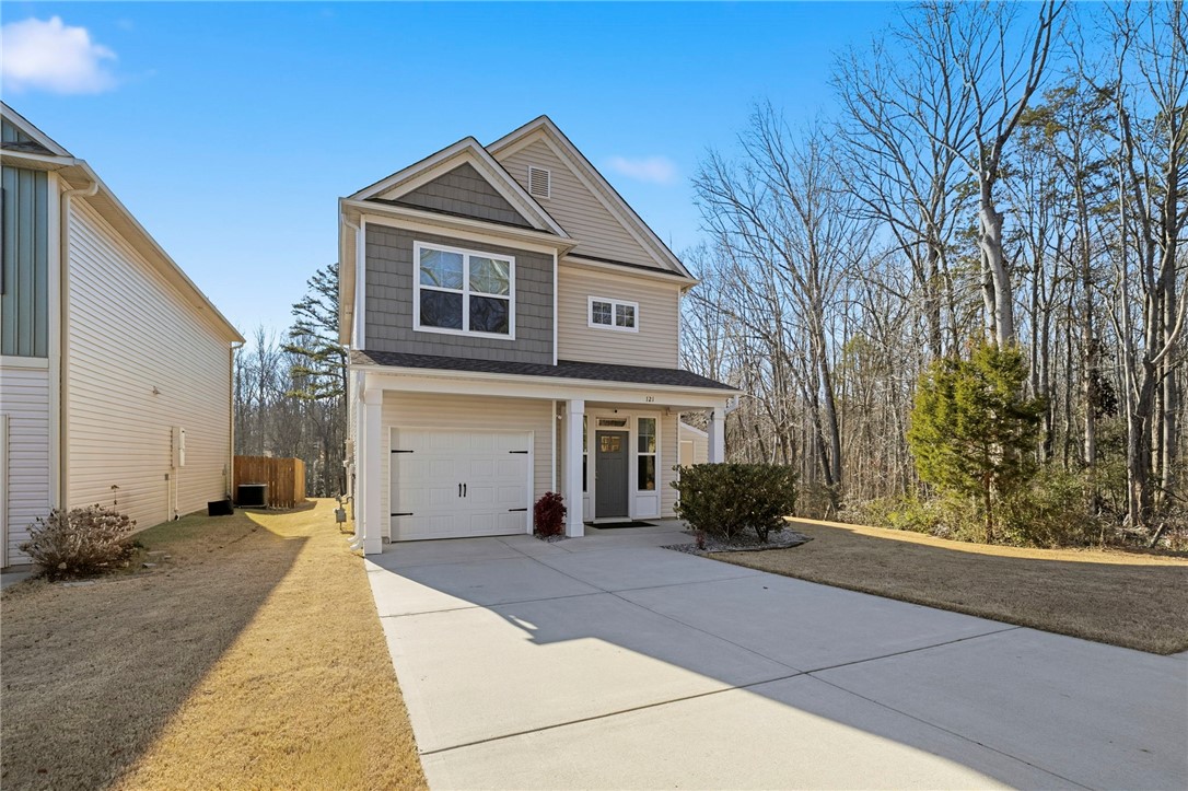 This inviting residence features a well-maintained exterior and a welcoming entryway.