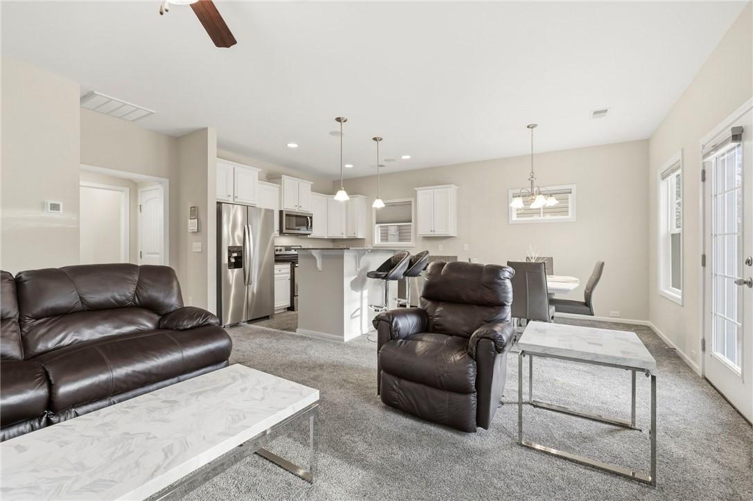 121 Wheaton Court Simpsonville, SC 29680 - Photo 12 of 40 This inviting space combines comfort and functionality, offering an ideal setting for daily living.