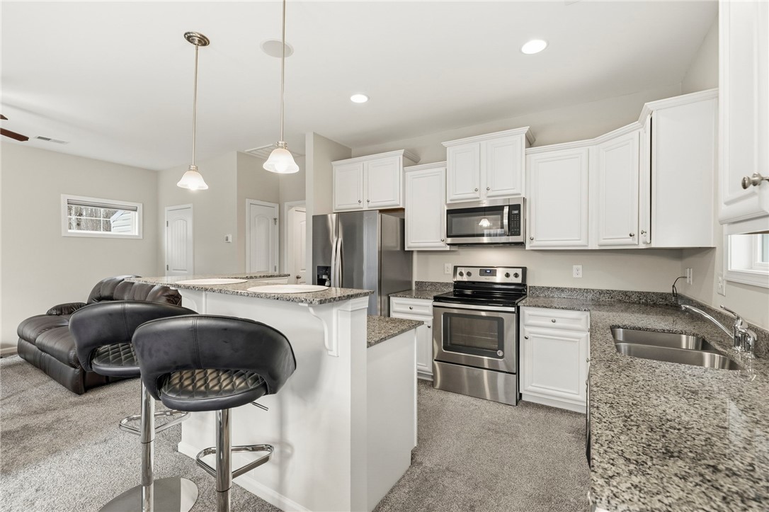 121 Wheaton Court Simpsonville, SC 29680 - Photo 14 of 40 This functional kitchen features ample counter space and modern appliances, perfect for any culinary enthusiast.