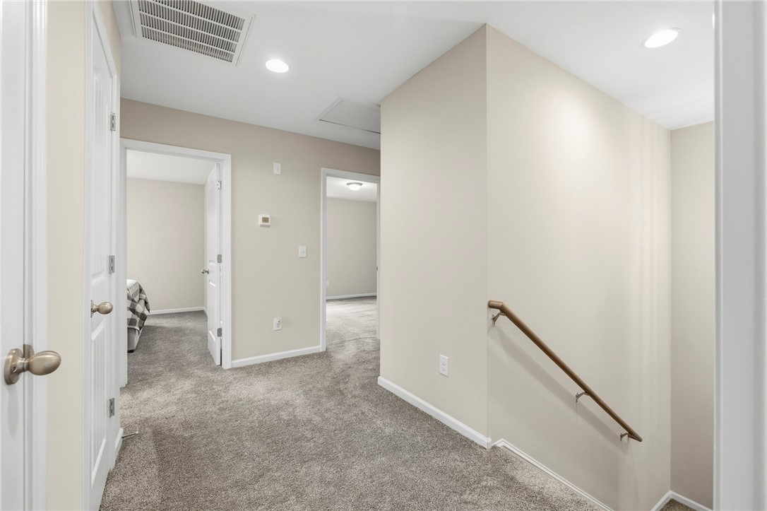 121 Wheaton Court Simpsonville, SC 29680 - Photo 21 of 40 A well-lit landing provides access to various rooms, showcasing comfort and accessibility.