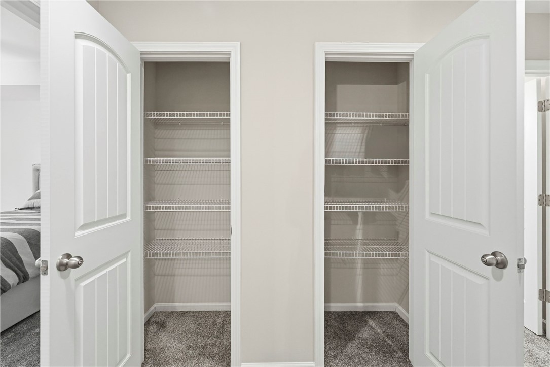 121 Wheaton Court Simpsonville, SC 29680 - Photo 23 of 40 These two spacious closets with wire shelving provide ample storage for any homeowner.