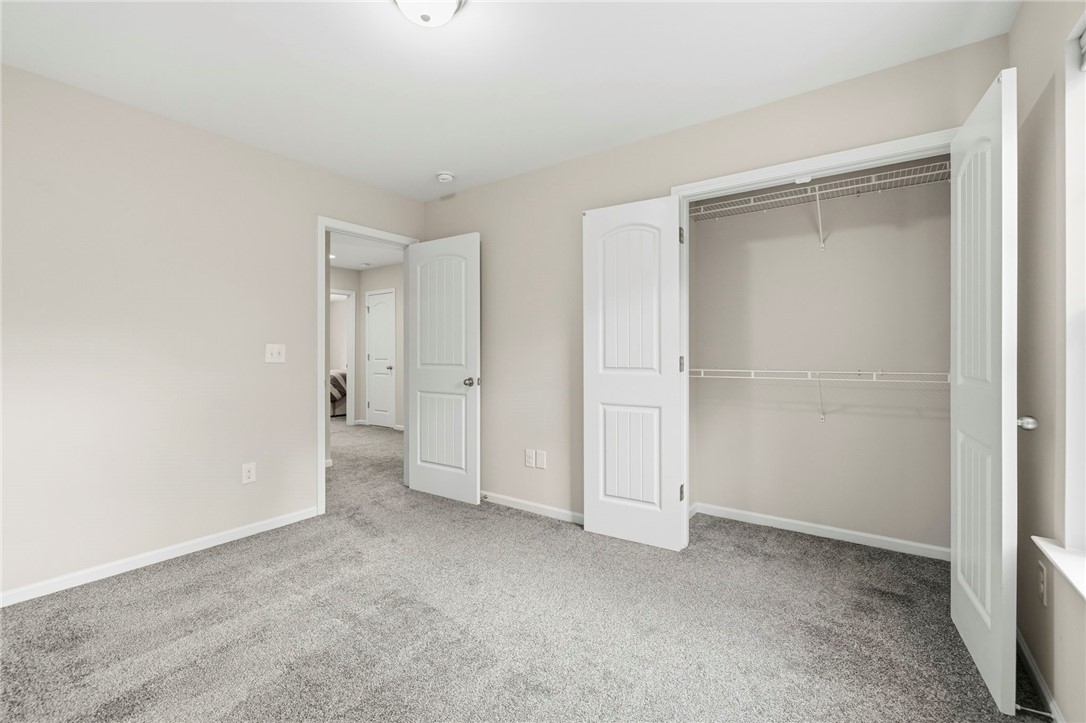 121 Wheaton Court Simpsonville, SC 29680 - Photo 26 of 40 This spacious room offers comfortable carpeting and convenient closet storage for all your needs.