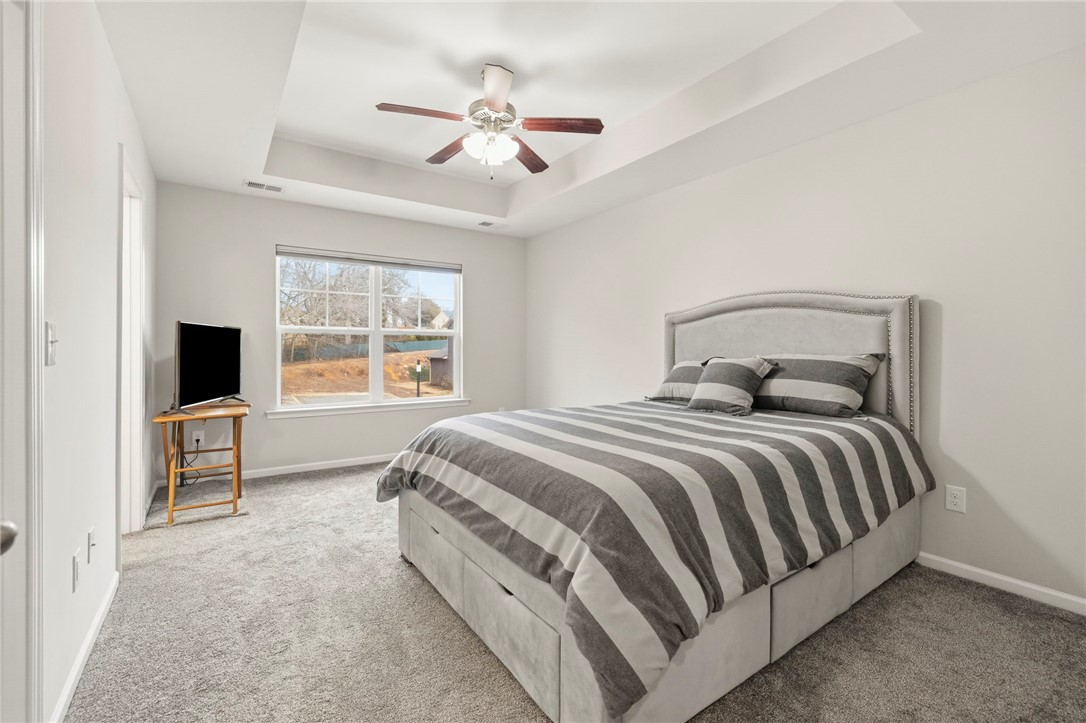 121 Wheaton Court Simpsonville, SC 29680 - Photo 32 of 40 This tranquil bedroom features plush carpeting and abundant natural light.