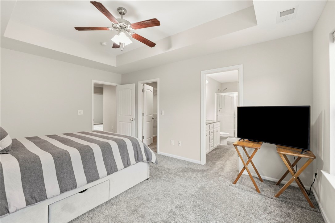 121 Wheaton Court Simpsonville, SC 29680 - Photo 34 of 40 This spacious bedroom offers comfortable living with direct access to a private bathroom.