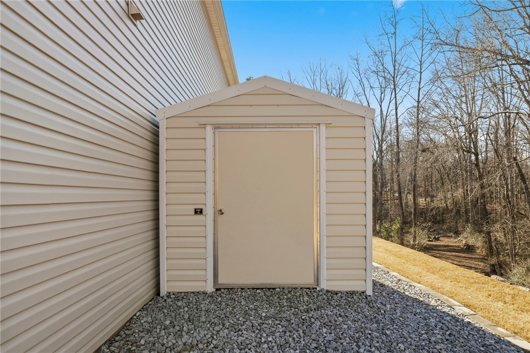 121 Wheaton Court Simpsonville, SC 29680 - Photo 39 of 40 This outdoor storage shed offers convenient organization for tools and equipment.