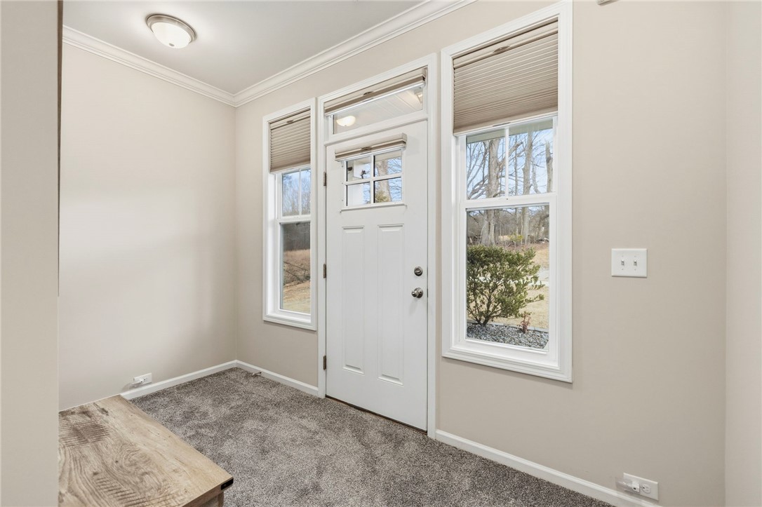 121 Wheaton Court Simpsonville, SC 29680 - Photo 8 of 40 This inviting entry features a classic door with sidelights, providing abundant natural light.