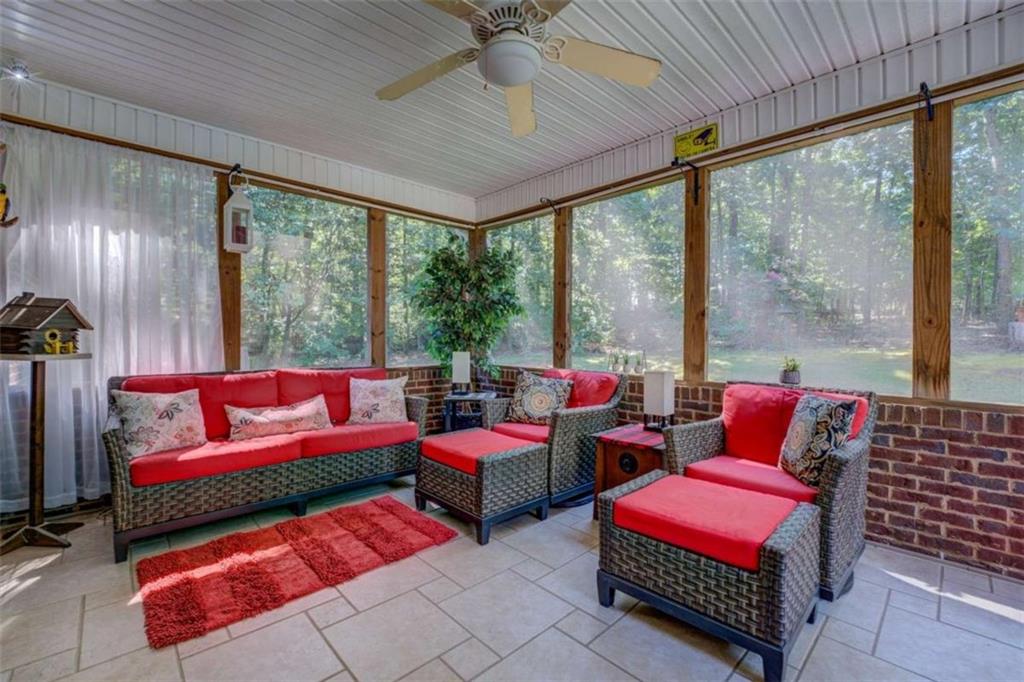 455 Bethany Road Covington, GA 30016 - Photo 11 of 39 a living room with furniture and a large window