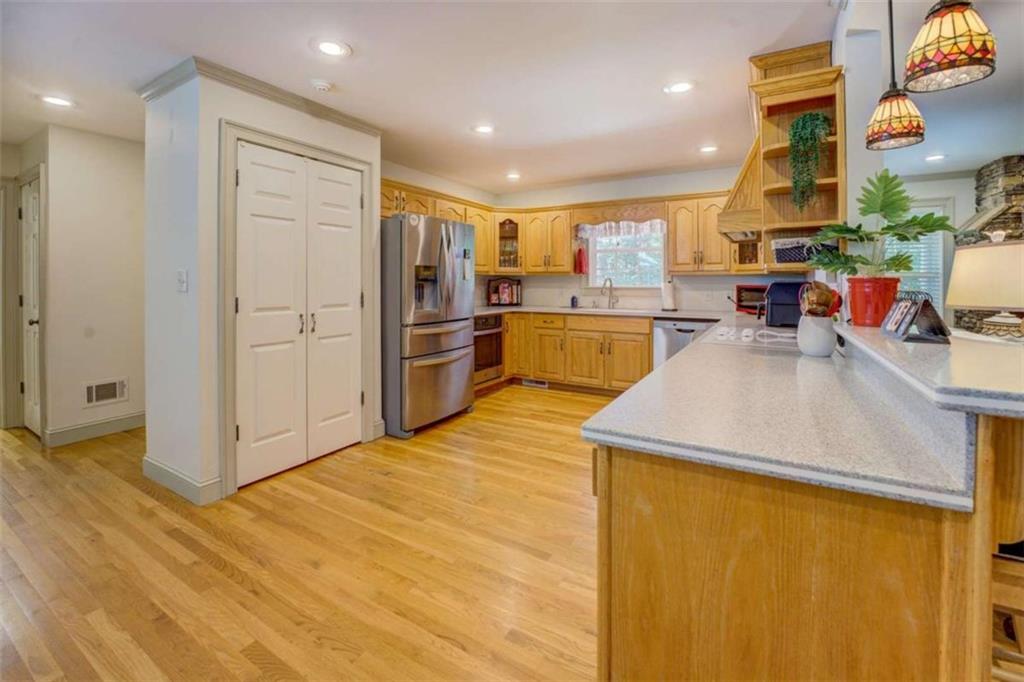 455 Bethany Road Covington, GA 30016 - Photo 12 of 39 a kitchen with stainless steel appliances a refrigerator and a stove