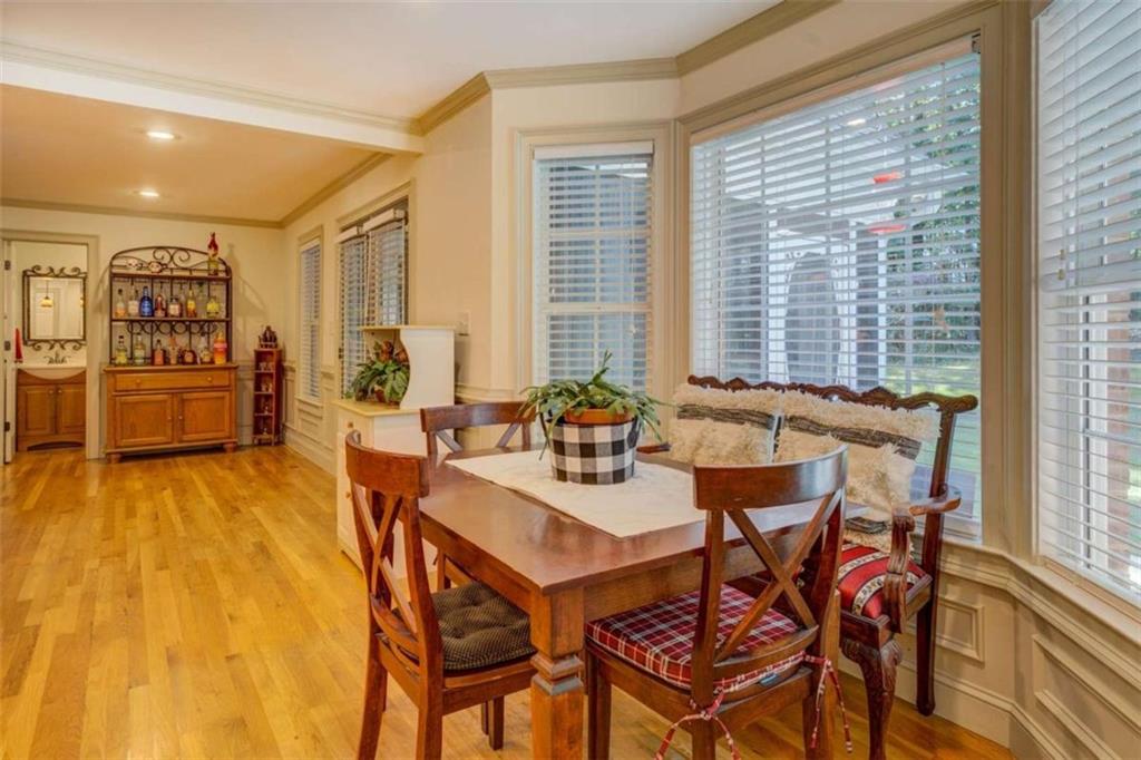 455 Bethany Road Covington, GA 30016 - Photo 14 of 39 a view of a dining room with furniture and wooden floor