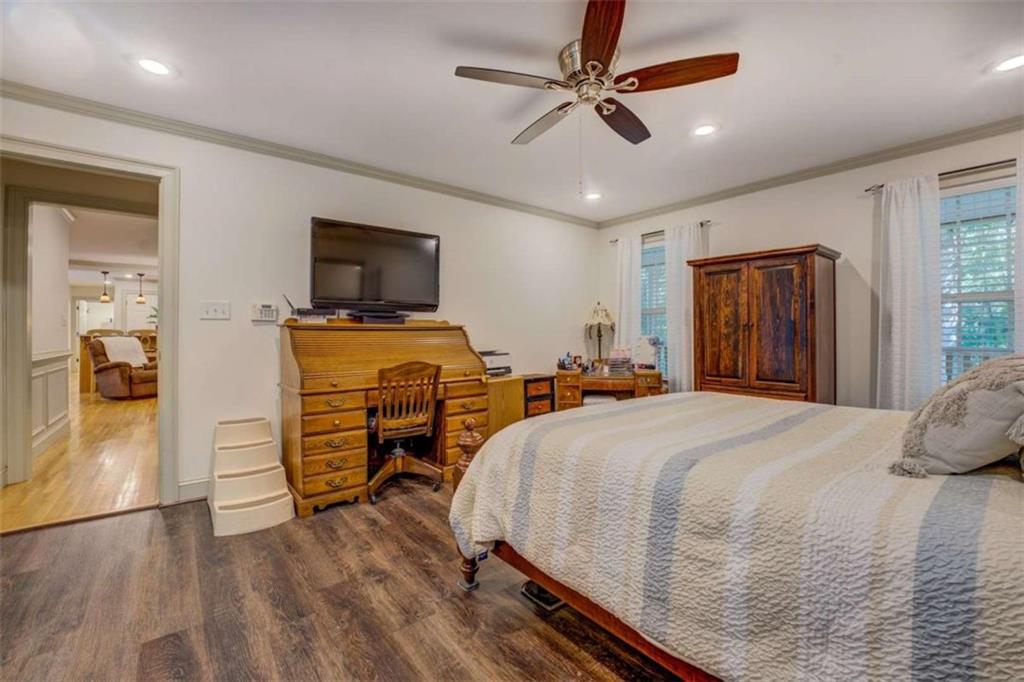 455 Bethany Road Covington, GA 30016 - Photo 17 of 39 a bedroom with a bed and a flat tv screen