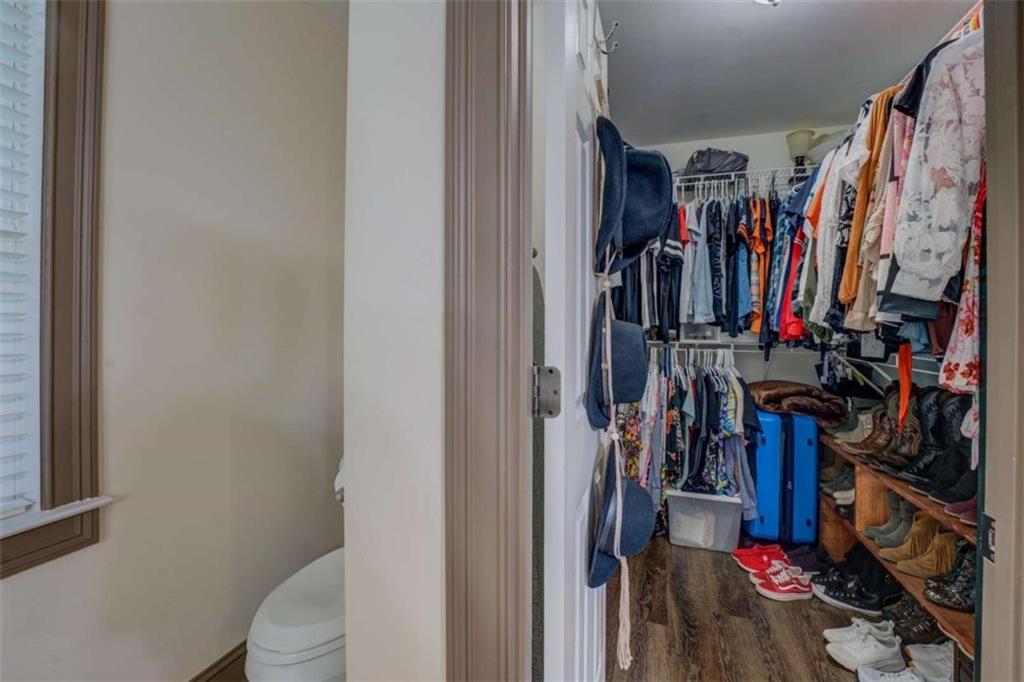 455 Bethany Road Covington, GA 30016 - Photo 20 of 39 a view of walk in closet with clothes
