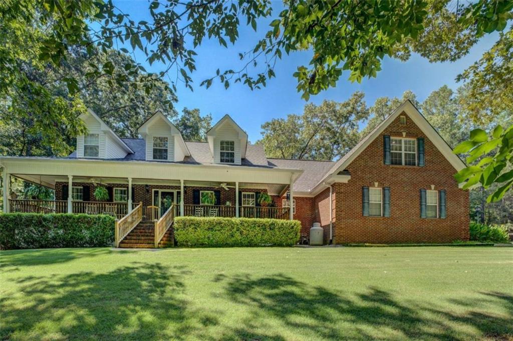 455 Bethany Road Covington, GA 30016 - Photo 2 of 39 a front view of a house with a yard