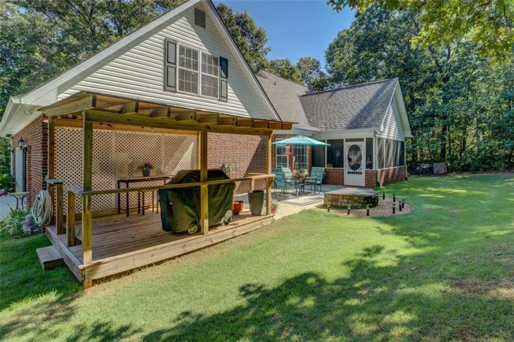 455 Bethany Road Covington, GA 30016 - Photo 30 of 39 aerial view of a house with backyard porch and sitting area