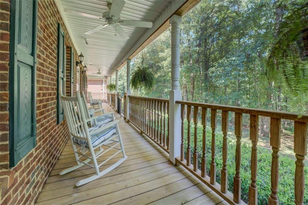 455 Bethany Road Covington, GA 30016 - Photo 3 of 39 a view of balcony with wooden floor and fence