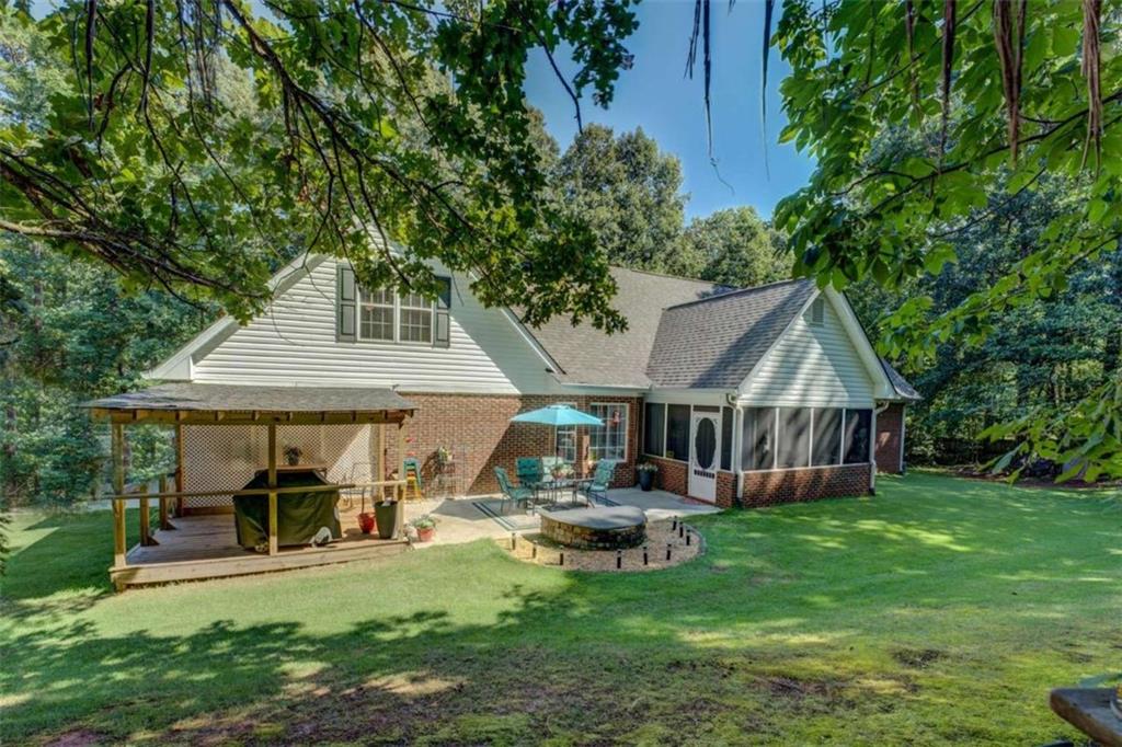 455 Bethany Road Covington, GA 30016 - Photo 33 of 39 a view of a house with backyard and sitting area