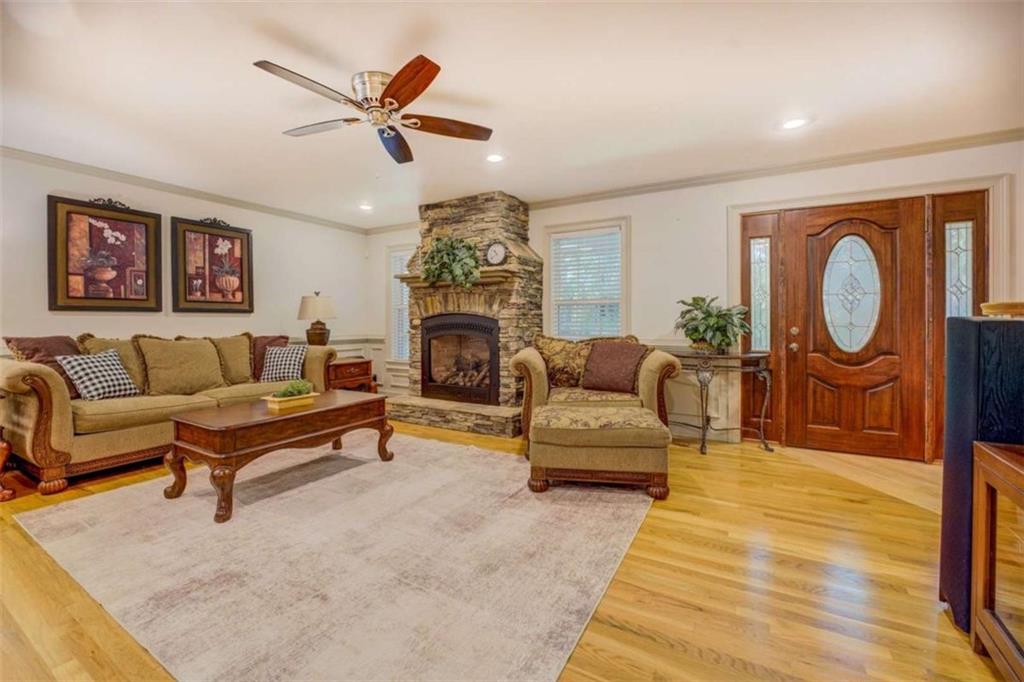 455 Bethany Road Covington, GA 30016 - Photo 6 of 39 a living room with furniture and a fireplace
